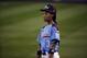 Philadelphia's Mo'ne Davis (3) pauses during a play review during the second inning of an elimination baseball game against Chicago at the Little League World Series tournament in South Williamsport, Pa., Thursday, Aug. 21, 2014. Chicago won 6-5. (AP Photo/Gene J. Puskar)
