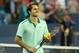 Aug 16, 2014; Cincinnati, OH, USA; Roger Federer (SUI) hits tennis balls to fans in the stands on day six of the Western and Southern Open tennis tournament at Linder Family Tennis Center. Mandatory Credit: Aaron Doster-USA TODAY Sports