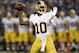 Washington Redskins quarterback Robert Griffin III throws to a receiver in the first half of an NFL preseason football game against the Baltimore Ravens, Saturday, Aug. 23, 2014, in Baltimore. (AP Photo/Nick Wass)