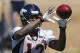 Denver Broncos wide receiver Andre Caldwell catches a pass during an NFL football organized team practice at the Broncos training facility in Englewood, Colo., on Monday, June 2, 2014. (AP Photo/Ed Andrieski)