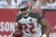Tampa Bay Buccaneers running back Doug Martin (22) carries the ball against the Miami Dolphins during the first quarter of an NFL preseason football game Saturday, Aug. 16, 2014, in Tampa, Fla. (AP Photo/Phelan M. Ebenhack)