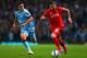 MANCHESTER, ENGLAND - AUGUST 25: Alberto Moreno of Liverpool competes with Samir Nasri of Manchester City during the Barclays Premier League match between Manchester City and Liverpool at the Etihad Stadium on August 25, 2014 in Manchester, England. (Photo by Clive Brunskill/Getty Images)