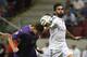 Real Madrid's Alvaro Arbeloa, right, and Fiorentina's Mario Gomez from Germany during their friendly soccer match in Warsaw, Poland, Saturday, Aug. 16, 2014. (AP Photo/Czarek Sokolowski)