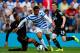LONDON, ENGLAND - AUGUST 16: Curtis Davies of Hull City slides in to tackle Loic Remy of Queens Park Rangers during the Barclays Premier League match between Queens Park Rangers and Hull City at Loftus Road on August 16, 2014 in London, England. (Photo by Steve Bardens/Getty Images)