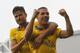 Arsenal's Lukas Podolski, right, celebrates his second goal against Fulham with teammate Olivier Giroud during their English Premier League soccer match at Craven Cottage, London, Saturday, Aug. 24, 2013. (AP Photo/Sang Tan)