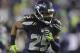 Seattle Seahawks' cornerback Richard Sherman runs on the field before an NFL football game against the New Orleans Saints, Monday, Dec. 2, 2013, in Seattle. (AP Photo/Scott Eklund)