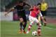 Besiktas's Ismail Koybasi, left, and Santi Cazorla of Arsenal fight for the ball during their Champions League play-off first leg soccer match in Istanbul, Turkey, Tuesday, Aug. 19, 2014. (AP Photo)
