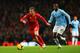 MANCHESTER, ENGLAND - DECEMBER 26: Lucas of Liverpool is closed down by Yaya Toure of Manchester City during the Barclays Premier League match between Manchester City and Liverpool at Etihad Stadium on December 26, 2013 in Manchester, England. (Photo by Alex Livesey/Getty Images)