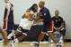 USA Basketball forward/center Anthony Davis of the New Orleans Jazz, left, watches teammate Kenneth Faried of the Denver Nuggets post up during a team practice at the Brooklyn Nets training facility in East Rutherford, N.J., Tuesday, Aug. 19, 2014. Team USA faces the Dominican Republic in an exhibition game Wednesday at Madison Square Garden in New York in preparation for the FIBA World Cup tournament Aug. 30-Sept. 14 in Spain. (AP Photo/Kathy Willens)