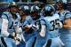 CHARLOTTE, NC - DECEMBER 28: T.J. Logan #8 of the North Carolina Tar Heels celebrates with teammates after returning a kick for a touchdown during their game against the Cincinnati Bearcats at Bank of America Stadium on December 28, 2013 in Charlotte, North Carolina. (Photo by Streeter Lecka/Getty Images)
