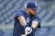 San Diego Padres first baseman Yonder Alonso, who is hitting a fourth best in the majors leagues at .421 since the all-star break, swings a weight batted getting lose during pre-game activity prior to a baseball game against the Colorado Rockies Tuesday, Aug. 12, 2014, in San Diego. (AP Photo/Lenny Ignelzi)