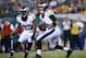 Philadelphia Eagles' Nick Foles, right, and LeSean McCoy run a play during the first half of an NFL preseason football game against the Pittsburgh Steelers, Thursday, Aug. 21, 2014, in Philadelphia. (AP Photo/Michael Perez)