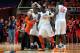 Jan 4, 2014; Champaign, IL, USA; Illinois Fighting Illini head coach John Groce holds back his team during a skirmish during the second half against the Penn State Nittany Lions at State Farm Center. Illinois defeated Penn State 75-55. Mandatory Credit: Bradley Leeb-USA TODAY Sports