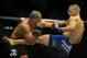 May 24, 2014; Las Vegas, NV, USA; TJ Dillashaw (blue) lands a kick on Renan Barao (red) during their UFC 173 bantamweight championship bout at MGM Grand Garden Arena. Dillashaw won the bout by way of TKO. Mandatory Credit: Stephen R. Sylvanie-USA TODAY Sports