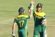 South African player Faf du Plessis, right, celebrates with AB de Villiers after scoring 100 runs during the cricket One Day International match against Australia in Harare Zimbabwe Wednesday, Aug. 27, 2014. The two teams are in Zimbabwe for a triangular ODI series with Zimbabwe (AP Photo/Tsvangirayi Mukwazhi)