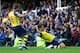 LIVERPOOL, ENGLAND - AUGUST 23: Olivier Giroud of Arsenal scoring his teams second goal and equalizer with teammate Nacho Monreal during the Barclays Premier League match between Everton and Arsenal at Goodison Park on August 23, 2014 in Liverpool, England. (Photo by Clive Brunskill/Getty Images)