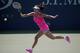Shuai Peng, of China, returns a shot against Agnieszka Radwanska, of Poland, of Australia, during the second round of the 2014 U.S. Open tennis tournament, Wednesday, Aug. 27, 2014, in New York. (AP Photo/Elise Amendola)