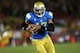 LOS ANGELES, CA - NOVEMBER 30: Quarterback Brett Hundley #17 of the UCLA Bruins carries on a 12 yard touchdown run in the third quarter against the USC Trojans at Los Angeles Coliseum on November 30, 2013 in Los Angeles, California. The Bruins won 35-14. (Photo by Stephen Dunn/Getty Images)