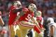 San Francisco 49ers linebacker Aaron Lynch (59) celebrates with defensive end Quinton Dial (92) during the second half of an NFL preseason football game against the San Diego Chargers in Santa Clara, Calif., Sunday, Aug. 24, 2014. The 49ers won 21-7. (AP Photo/Mathew Sumner)