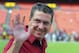 Washington Redskins owner Dan Snyder waves toward the crowd before an NFL football preseason game against the New England Patriots in Landover, Md., Thursday, Aug. 7, 2014. (AP Photo/Richard Lipski)