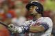 Atlanta Braves' Justin Upton hits a two-run home run off Cincinnati Reds relief pitcher Manny Parra in the 12th inning of a baseball game, Friday, Aug. 22, 2014, in Cincinnati. Atlanta won 3-1 in 12 inninngs. (AP Photo/Al Behrman)