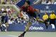 Novak Djokovic, of Serbia, follows through on a serve to Diego Schwartzman, of Argentina, during the opening round of the U.S. Open tennis tournament Monday, Aug. 25, 2014, in New York. (AP Photo/Darron Cummings)