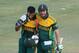 South African batsman AB de Villiers, right, and JP Duminy, smile while walking off the pitch after South Africa won by 7 wickets in the cricket One Day International match against Australia in Harare, Zimbabwe, Wednesday, Aug. 27, 2014. The two teams are in Zimbabwe for a triangular ODI series with Zimbabwe. (AP Photo/Tsvangirayi Mukwazhi)