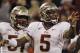 Florida State quarterback Jameis Winston (5) celebrates his touchdown run against Clemson during the second half of an NCAA college football game, Saturday, Oct. 19, 2013, in Clemson, S.C. Offensive linesman Bobby Hart is at left. (AP Photo/Mike Stewart)