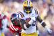 File-This Nov. 17, 2012 file photo shows LSU running back Jeremy Hill (33) rushing past Mississippi defensive back Trae Elston (7) on a 27-yard touchdown carry during the first half of their NCAA college football game, Saturday in Baton Rouge, La. A judge ruled she won't send Hill to jail for a probation violation last spring, a ruling that leaves it up to coach Les Miles to decide whether the Tigers' suspended leading rusher last season will return to the team. Miles did not immediately comment on the ruling or Hill's future, but players expressed hope after practice Monday Aug. 5, 2013 that Hill would return. (AP Photo/Gerald Herbert, File)