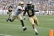 Colorado State Rams running back Kapri Bibbs (5) runs for a touchdown against Colorado Buffaloes defensive back Parker Orms (13) during the second quarter of an NCAA college football game Sunday, Sept. 1, 2013, in Denver. (AP Photo/Jack Dempsey)