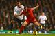 LONDON, ENGLAND - DECEMBER 15: Jordan Henderson of Liverpool is marked by Mousa Dembele of Tottenham Hotspur during the Barclays Premier League match between Tottenham Hotspur and Liverpool at White Hart Lane on December 15, 2013 in London, England. (Photo by Paul Gilham/Getty Images)