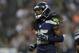 Seattle Seahawks cornerback Richard Sherman runs on the field in the first half of a preseason NFL football game against the Chicago Bears, Friday, Aug. 22, 2014, in Seattle. (AP Photo/John Froschauer)