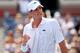 NEW YORK, NY - AUGUST 26: John Isner of the United States celebrates after defeating Marcos Giron of the United States to win their men's singles first round match on Day Two of the 2014 US Open at the USTA Billie Jean King National Tennis Center on August 26, 2014 in the Flushing neighborhood of the Queens borough of New York City. (Photo by Elsa/Getty Images)