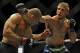 May 24, 2014; Las Vegas, NV, USA; Renan Barao (red) dodges a punch from TJ Dillashaw (blue) during their UFC 173 bantamweight championship bout at MGM Grand Garden Arena. Dillashaw won the bout by way of TKO. Mandatory Credit: Stephen R. Sylvanie-USA TODAY Sports