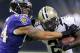 New Orleans Saints running back Khiry Robinson (29) carries against Baltimore Ravens linebacker John Simon (94) during the first half of an NFL preseason football game in New Orleans, Thursday, Aug. 28, 2014. (AP Photo/Bill Haber)