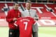 Manchester United's new player Angel Di Maria left, and manager Louis van Gaal, pose for photographers holding his new shirt, at Old Trafford Stadium in Manchester, England, Thursday, Aug. 28, 2014. Manchester United have signed winger Angel Di Maria from Real Madrid for a British record transfer fee of £59.7m. The Argentine winger had a medical in Manchester on Tuesday and has signed a five-year deal. (AP Photo/Alastair Grant)