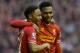 Liverpool's Daniel Sturridge, right, celebrates with teammate Raheem Sterling after scoring against Swansea City's during their English Premier League soccer match at Anfield Stadium, Liverpool, England, Sunday Feb. 23, 2014. (AP Photo/Jon Super)