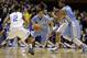 Duke's Quinn Cook (2) and Andre Dawkins (34) defend as North Carolina's Marcus Paige (5) drives while Leslie McDonald, right, blocks during the first half of an NCAA college basketball game in Durham, N.C., Saturday, March 8, 2014. (AP Photo/Gerry Broome)