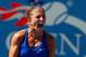 NEW YORK, NY - AUGUST 29: Sara Errani of Italy celebrates after defeating Venus Williams of the United States in their women's singles third round match on Day Five of the 2014 US Open at the USTA Billie Jean King National Tennis Center on August 29, 2014 in the Flushing neighborhood of the Queens borough of New York City. (Photo by Mike Stobe/Getty Images for USTA)