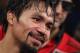Manny Pacquiao stands in the ring following his victory over Timothy Bradley in their WBO welterweight title boxing fight Saturday, April 12, 2014, in Las Vegas. (AP Photo/Isaac Brekken)