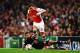 LONDON, ENGLAND - AUGUST 27: Mesut Oezil of Arsenal skips the tackle of Ismail Koybasl of Besiktas during the UEFA Champions League Qualifier 2nd leg match between Arsenal and Besiktas at the Emirates Stadium on August 27, 2014 in London, United Kingdom. (Photo by Shaun Botterill/Getty Images)