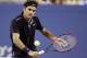 Roger Federer, of Switzerland, returns a shot to Sam Groth, of Australia, during the second round of the 2014 U.S. Open tennis tournament Friday, Aug. 29, 2014, in New York. (AP Photo/Darron Cummings)