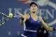 Eugenie Bouchard, of Canada, returns a shot to Sorana Cirstea, of Romania, during the second round of the 2014 U.S. Open tennis tournament Thursday, Aug. 28, 2014, in New York. (AP Photo/Darron Cummings)