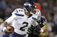Seattle Seahawks quarterback Terrelle Pryor (2) runs against Oakland Raiders linebacker Miles Burris during the second quarter of an NFL preseason football game in Oakland, Calif., Thursday, Aug. 28, 2014. (AP Photo/Marcio Jose Sanchez)