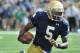 Notre Dame quarterback Evertt Golson (5) heads toward the end zone during an NCAA college football game with Rice in South Bend, Ind., Saturday, Aug. 30, 2014. (AP Photo/Joe Raymond)
