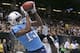Tennessee Titans wide receiver Justin Hunter (15) pulls in a touchdown reception over New Orleans Saints cornerback Corey White (24) in the first half of a NFL preseason football game in New Orleans, Friday, Aug. 15, 2014. (AP Photo/Bill Haber)