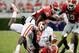 Georgia defenders wrap up a Clemson runner.