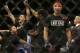 Danny Castillo, right, reacts as Tony Ferguson, second from left, has his arm raised in victory by referee Herb Dean after a lightweight mixed martial arts bout at UFC 177 in Sacramento, Calif., Saturday, Aug. 30, 2014. Ferguson won by split decision. (AP Photo/Jeff Chiu)