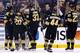 BOSTON, MA - NOVEMBER 29: Tuukka Rask #40 of the Boston Bruins celebrates with teammates following their 3-2 win against the New York Rangers during the game at TD Garden on November 29, 2013 in Boston, Massachusetts. (Photo by Jared Wickerham/Getty Images)