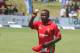Zimbabwean bowler Prosper Utseya walks off the pitch while holding the ball after getting a hat trick during the cricket One Day International match against South Africa in Harare, Zimbabwe, Friday, Aug. 29, 2014.(AP Photo/Tsvangirayi Mukwazhi)